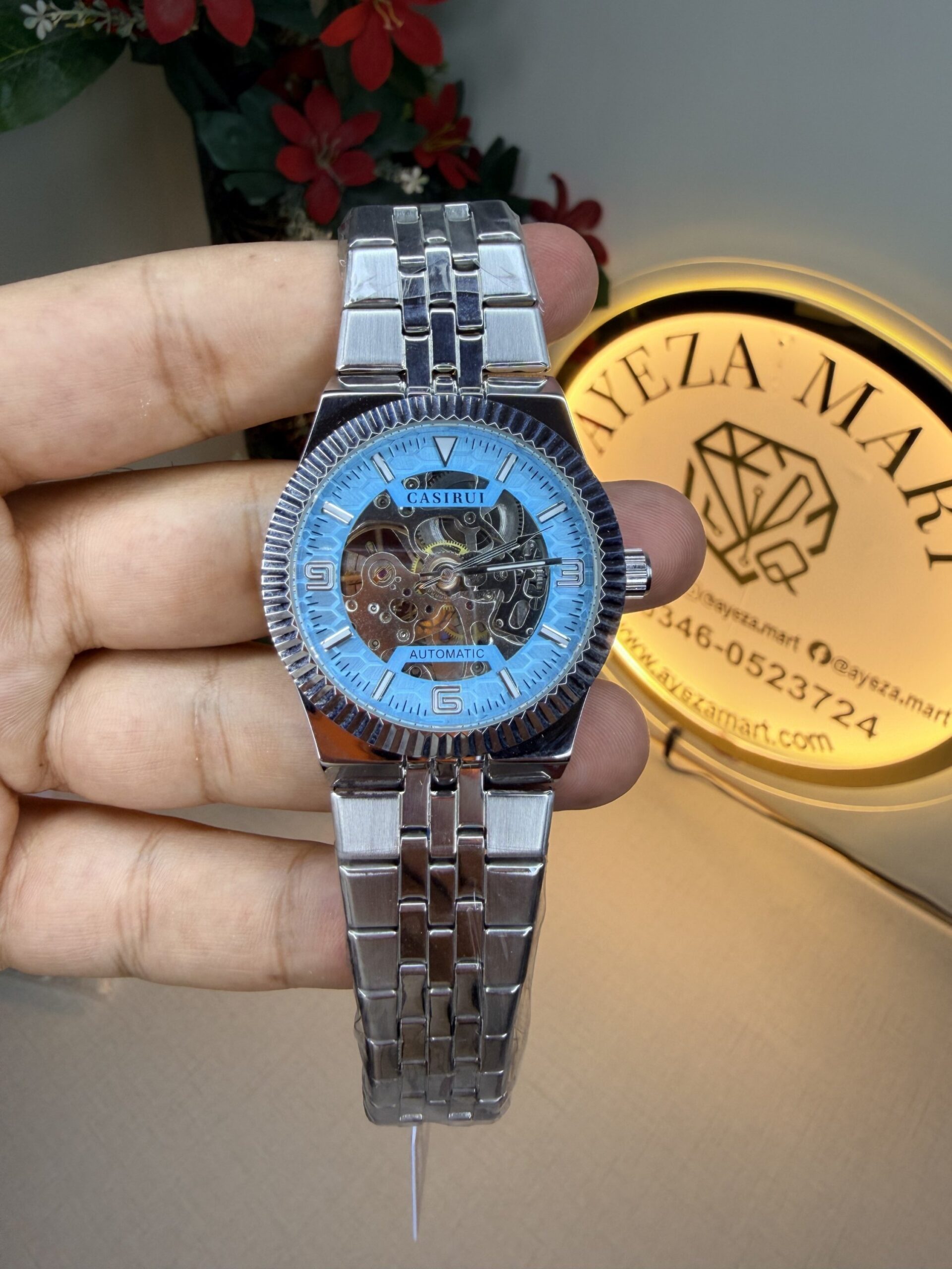 Skeleton watch for men sky blue automatic luxury open heart dial mechanical wrist watch with stainless steel bracelet in Pakistan showing visible gears and premium design